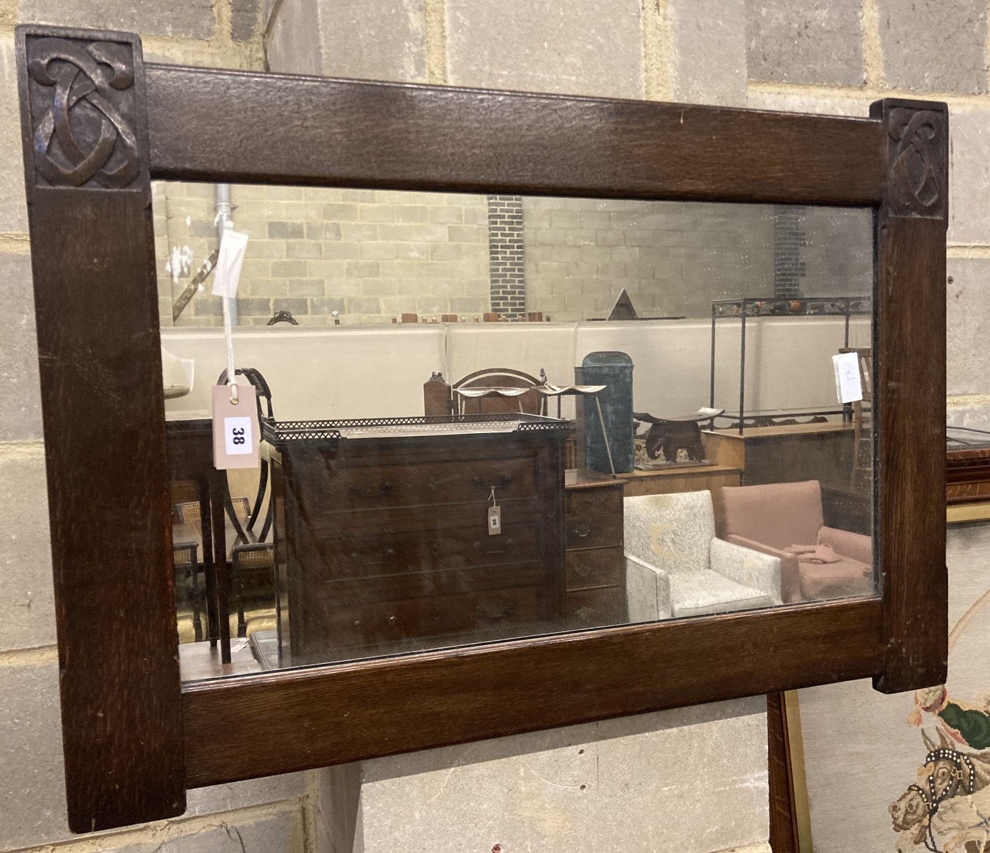 A Liberty rectangular carved oak wall mirror, width 91cm height 64cm